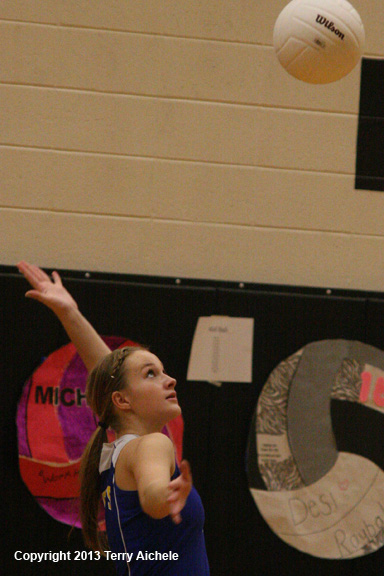 LEFT [img_4859] - RIGHT [img_4865]LEFT - A Pilot Rock player serves ...